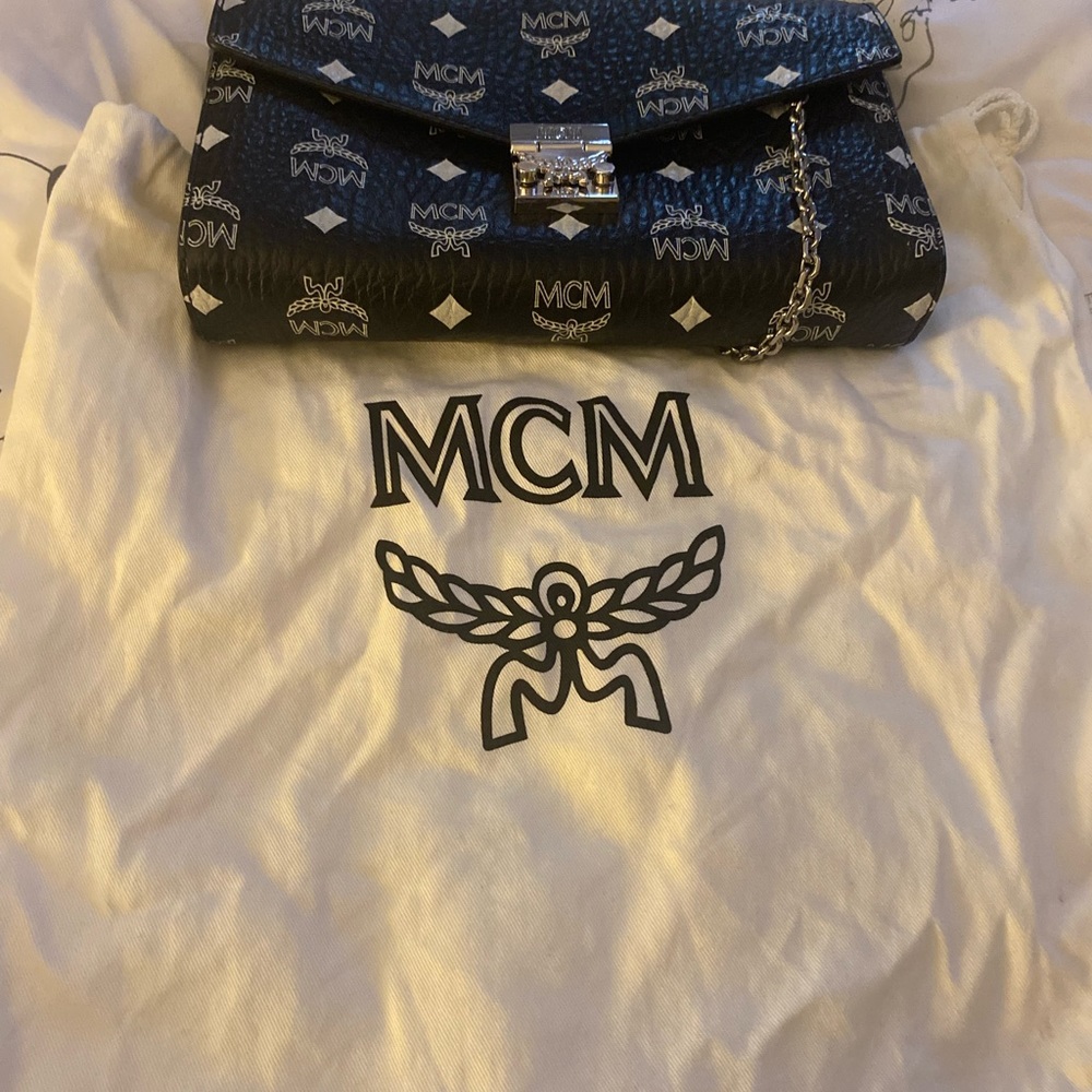 MCM black Crossbody. In mint condition.  Comes with duster bag.